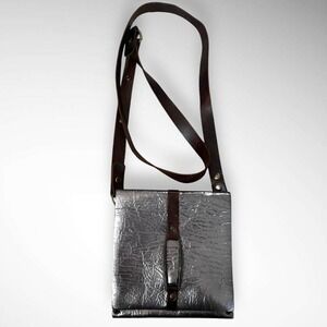 REBEL DESIGNS Unique Leather Metallic Crossbody Bag With Eyelet Detailing | EUC
